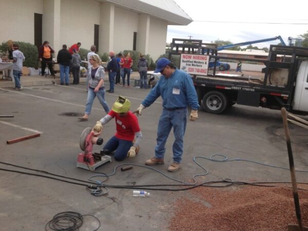 Volunteers performing wet saw prep work at Faith Lutheran School during the 2014 Arizona Builders Alliance Volunteer Day.